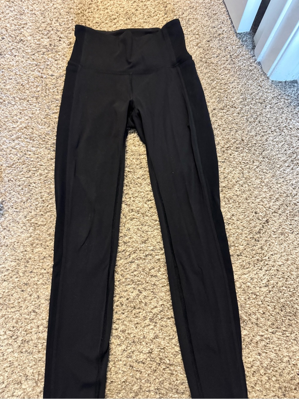Lululemon High-Waisted Black Leggings with side detail and pockets